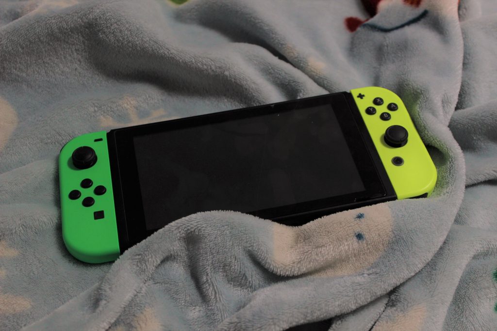 A Nintendo Switch on a blanket