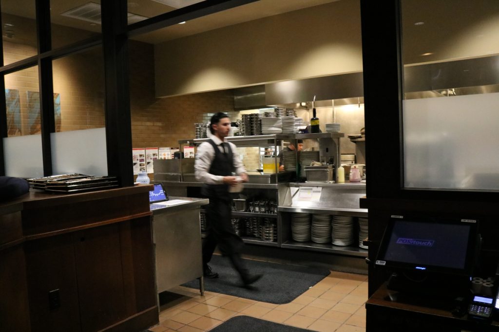 a photo of my older brother working in Fleming's