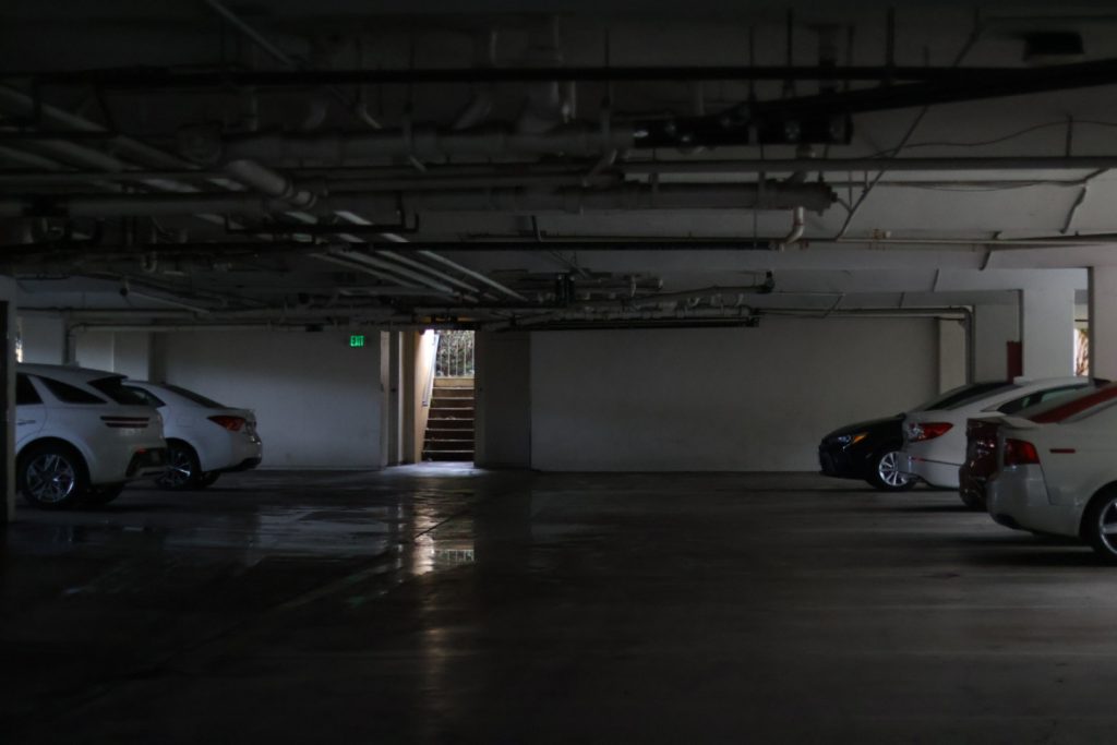 a garage basement with a staircase at the end of it