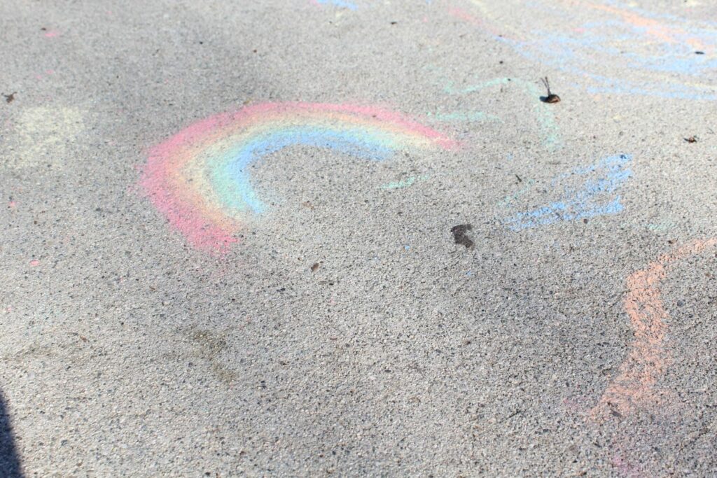 rainbow drawn with chalk on the ground
