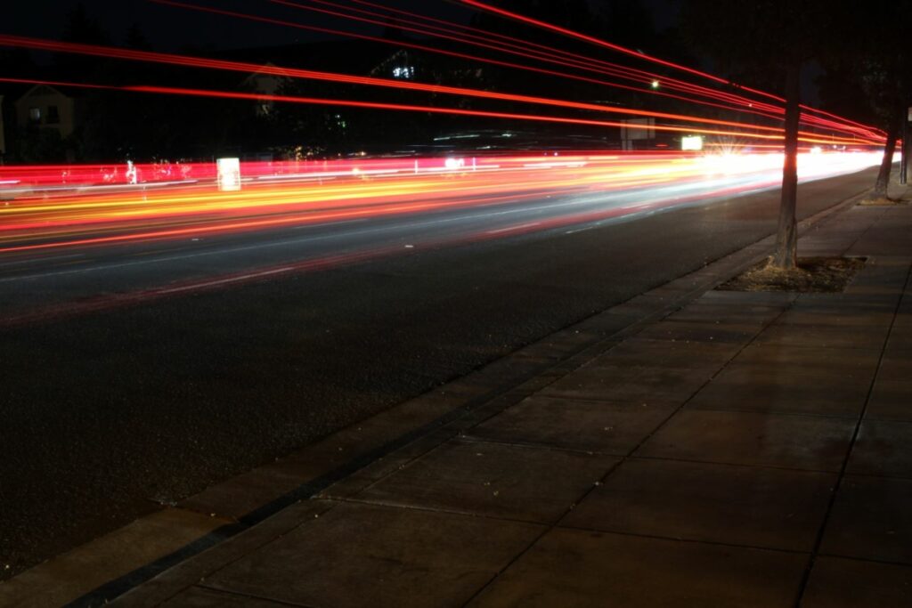 cars speeding by at night
