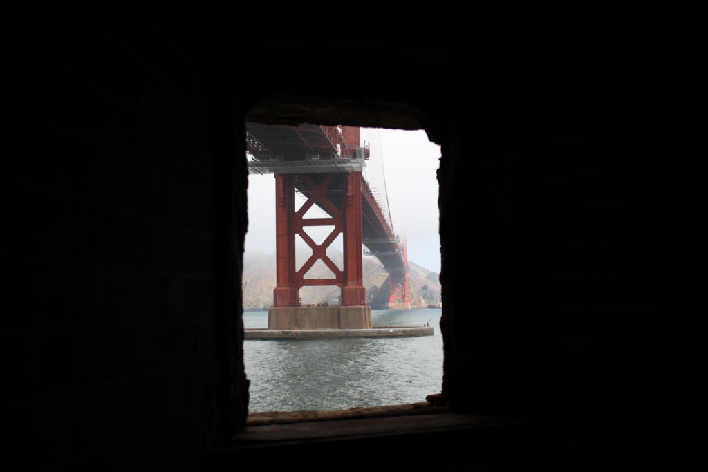 A view of the Golden Gate Bridge but out of a small window.