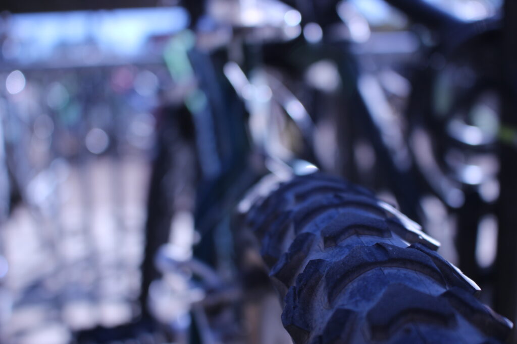 A close up of a bike tire with a blurry background