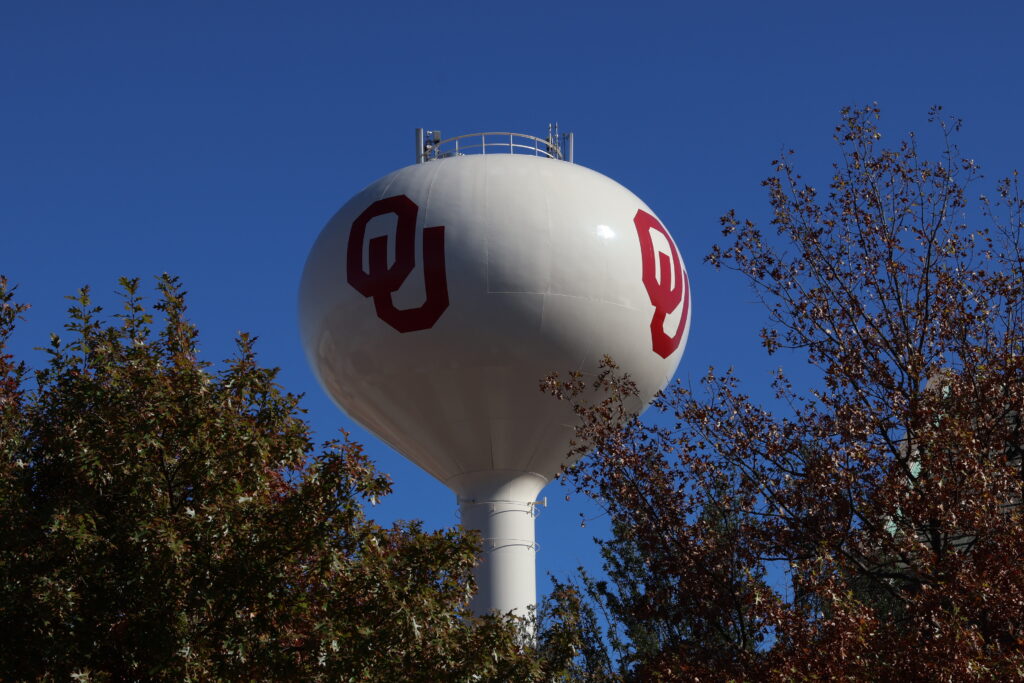 University of Oklahoma water tower surrounded by trees