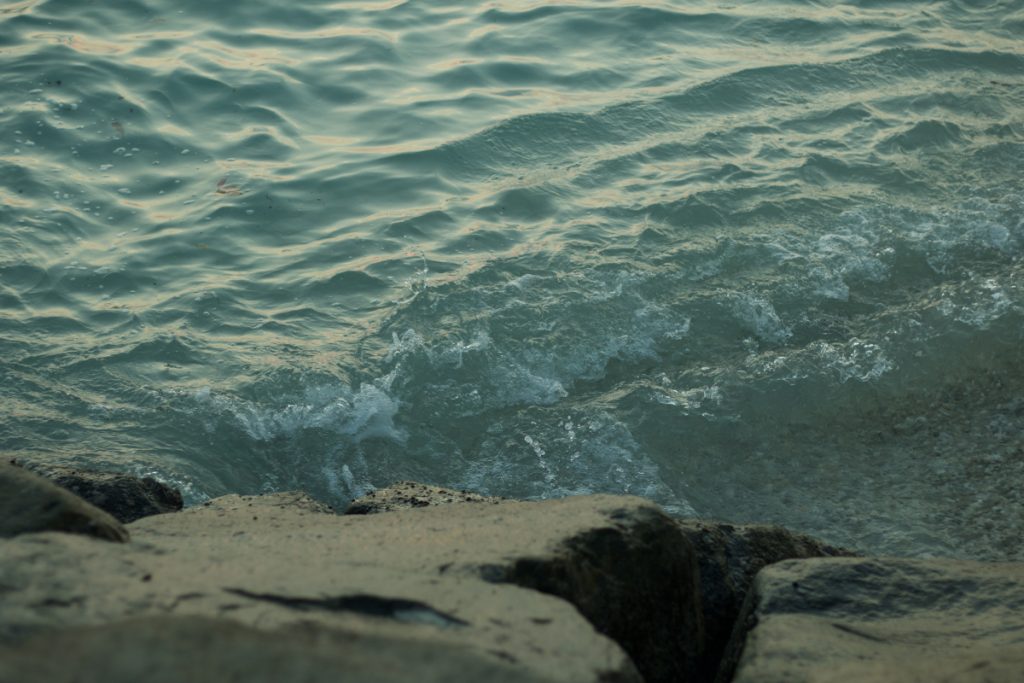 water splashing against rocks
