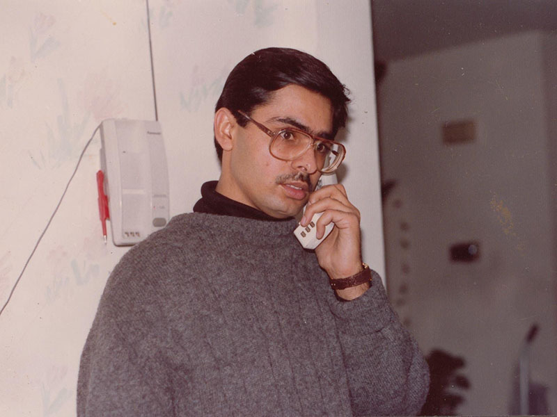 Sandeep on the phone with relatives from India