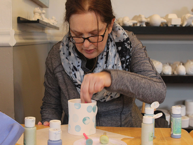 My mom painting her mug