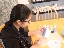 Maya painting her mug