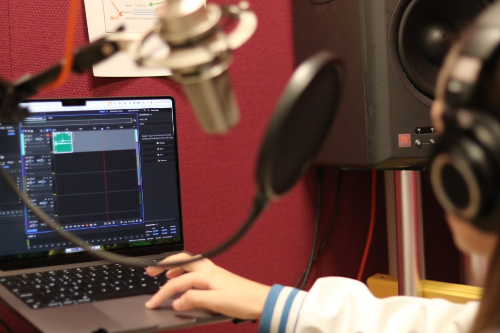 Photo of me editing in Adobe Audition at the ISO Booth at Freestyle.