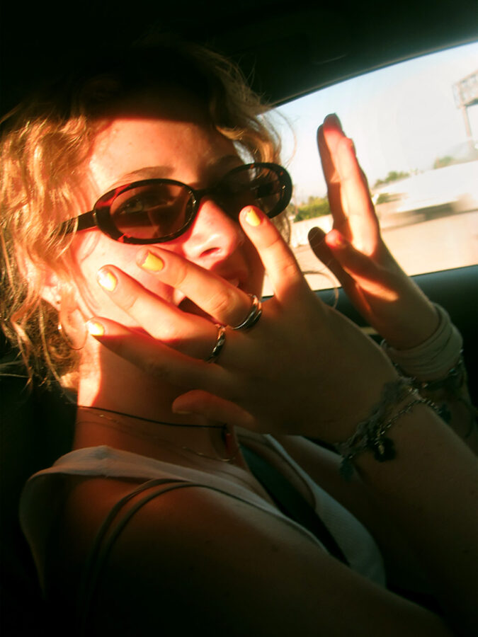 girl with sunglasses in car