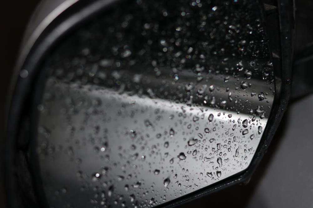 rain on car mirror