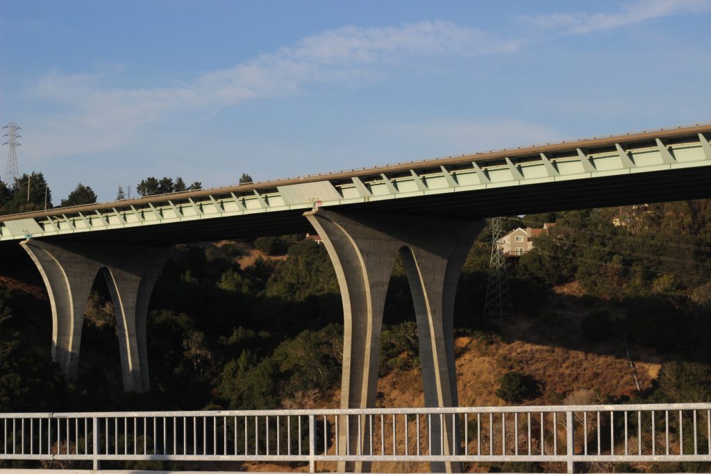 A photograph of a bridge and the blue sky in the background.