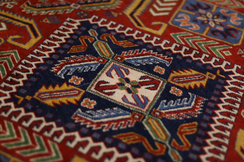 A red and blue patterned rug