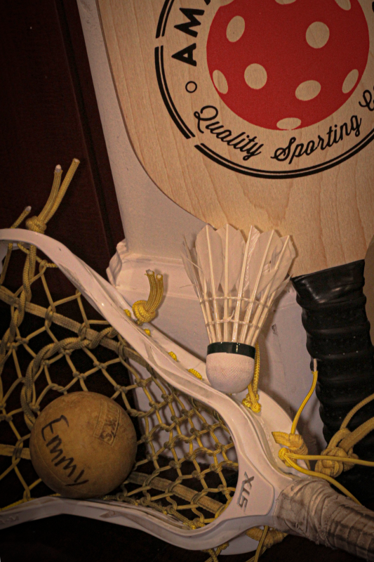 3 different sports equipment stacked around a corner, so each piece of equipment is facing a different direction - slight vignette added