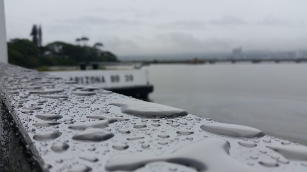 Water droplets on a metal handlebar at Pearl Harbor