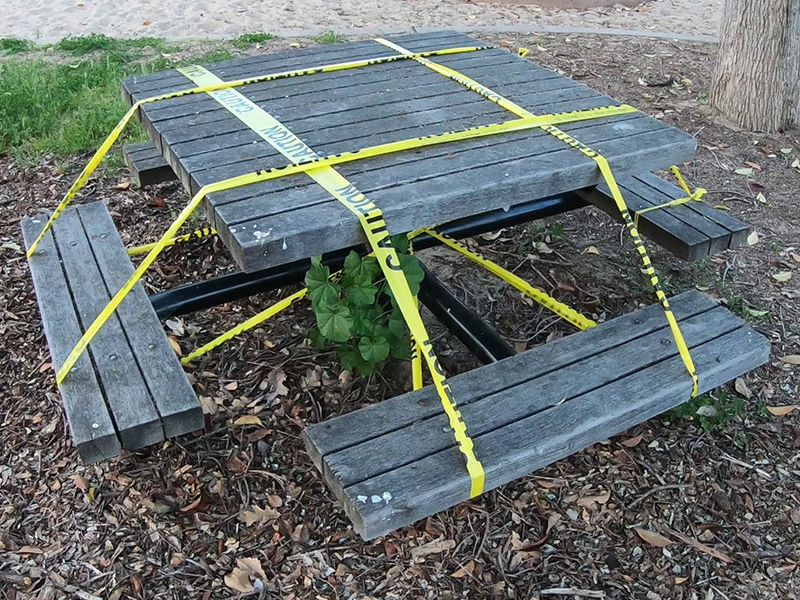 A taped off picnic bench