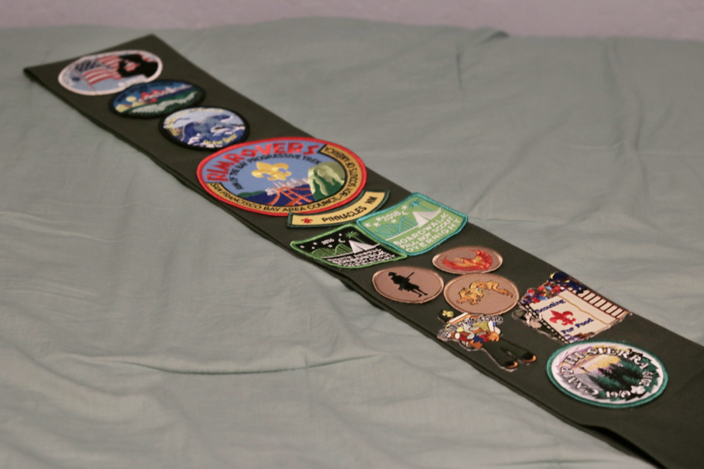 A sash with colorful patches of different shapes and sizes.