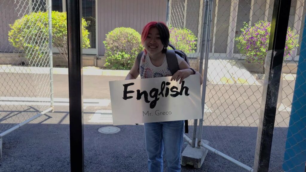 Fiona holding the English sign