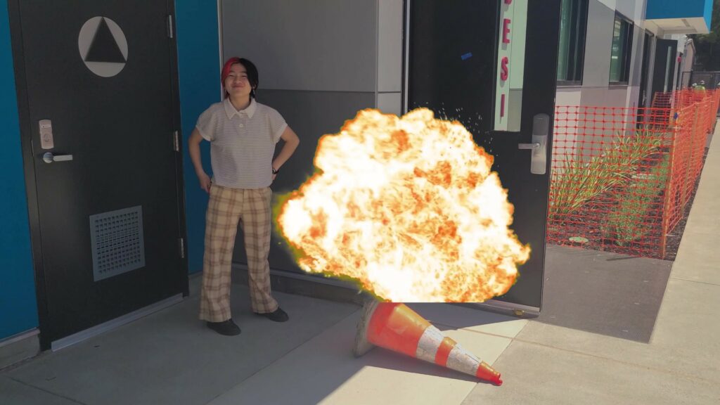 Fiona standing over an explosion
