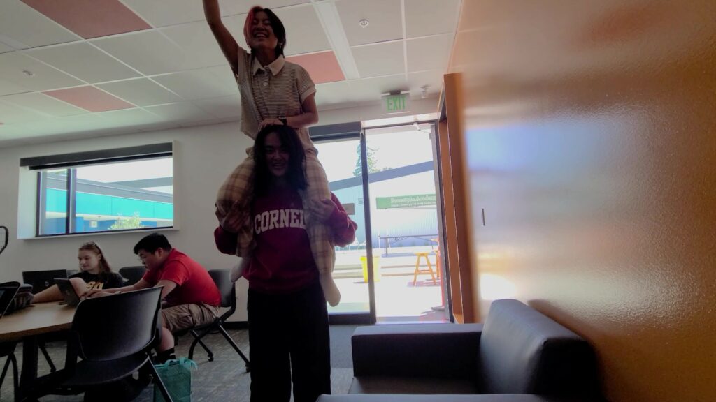 Fiona attempting to touch the ceiling