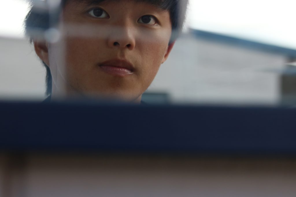 Self-portait of myself in a mirror cracked reflection