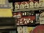 Cigarette packs being sold behind a gas station counter
