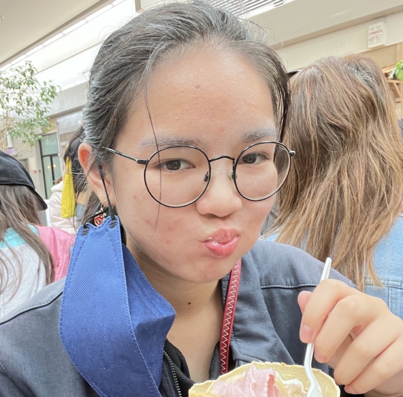 A picture of me eating a crepe in Japan Town.