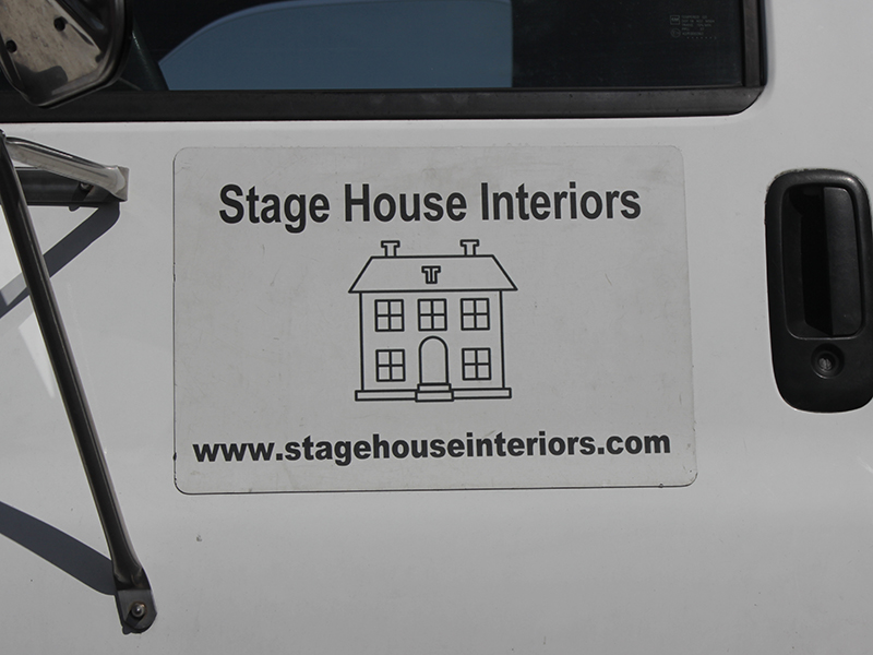 The logo located on the side of the Stage House Interiors truck.