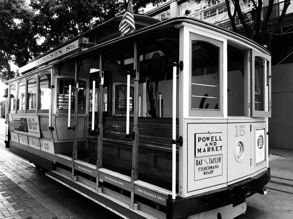 A photo of a trolley in San Francisco edited to be in black and white.