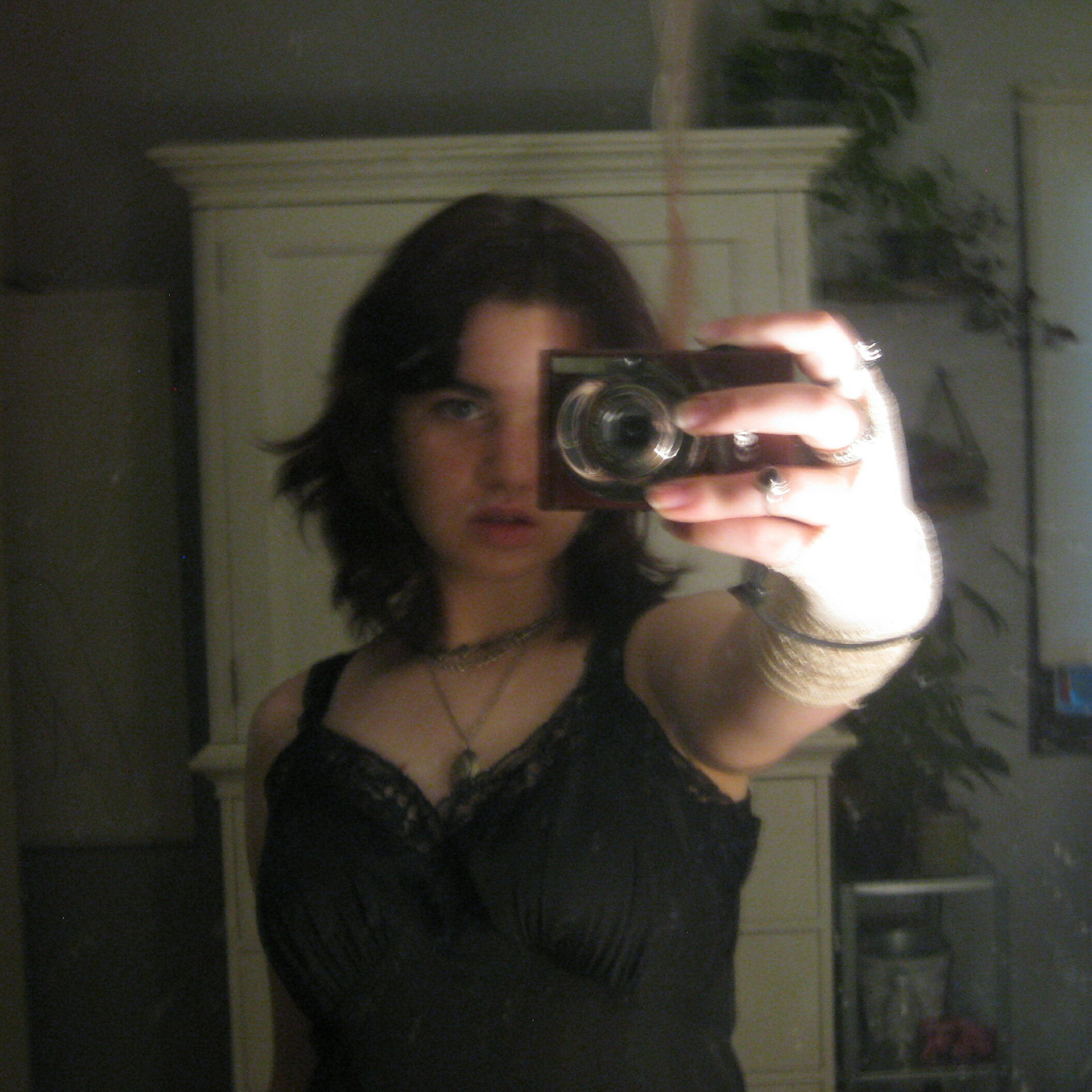 A mirror picture of me taken with an old digital camera