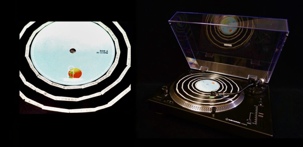 Chinese newspaper clippings on a vinyl record.
