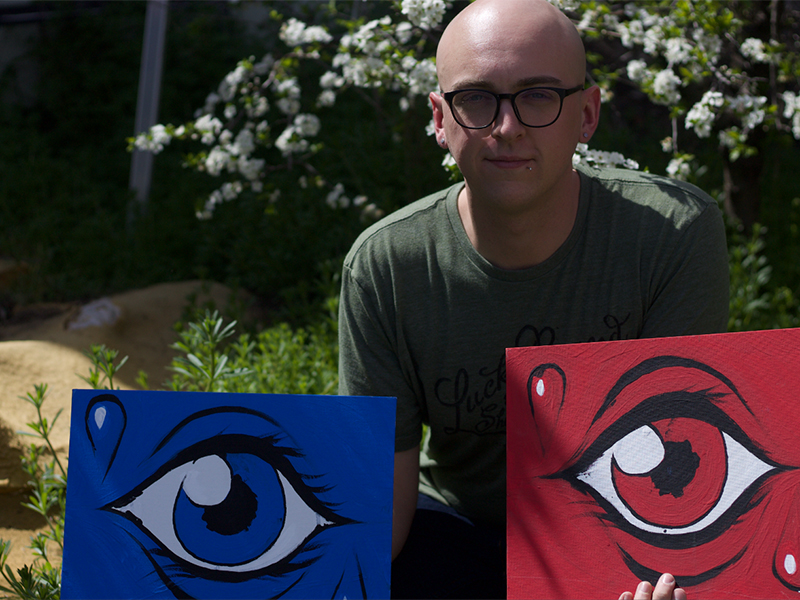Kyle Ames and two paintings