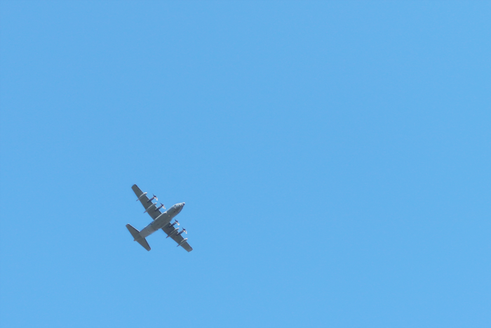 a plane soaring through the air