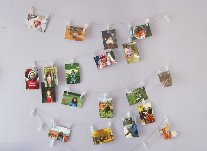 a photo wall showing a young girl growing up