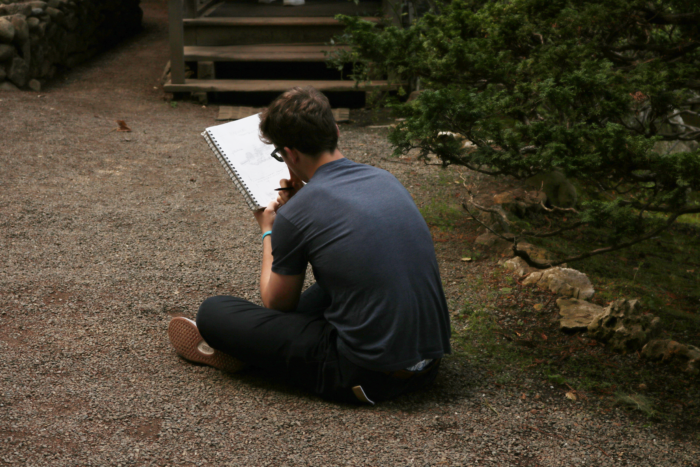 a man examining his drawing