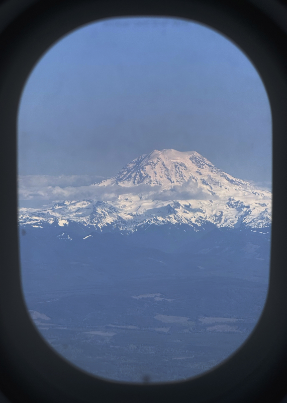 A view of Mt. Rainier in Washington State from an airplane window.