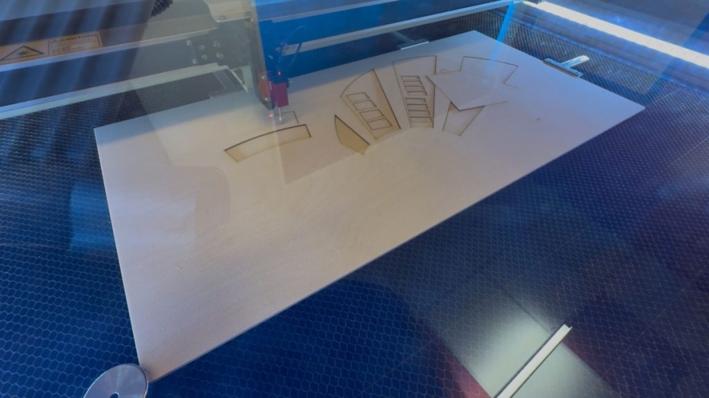 Laser cutting the wood for my project.