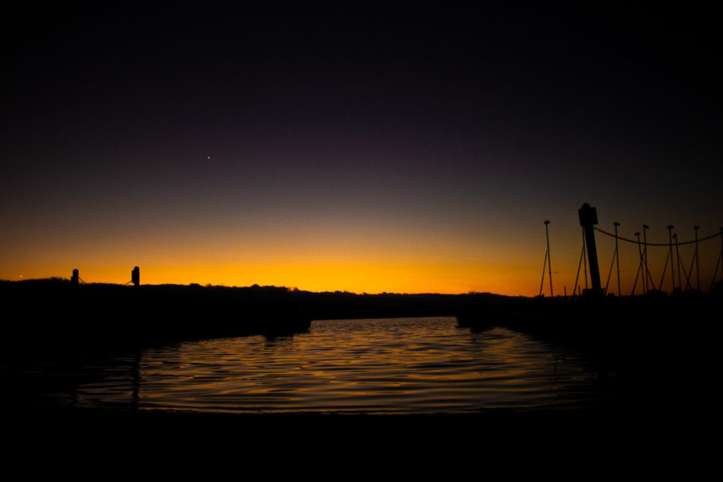sunset on a the reflective water