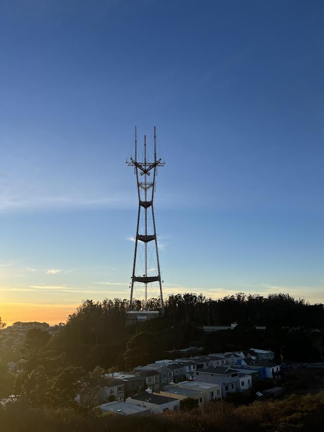 Sutro Tower at sunset in a bright blue sky .