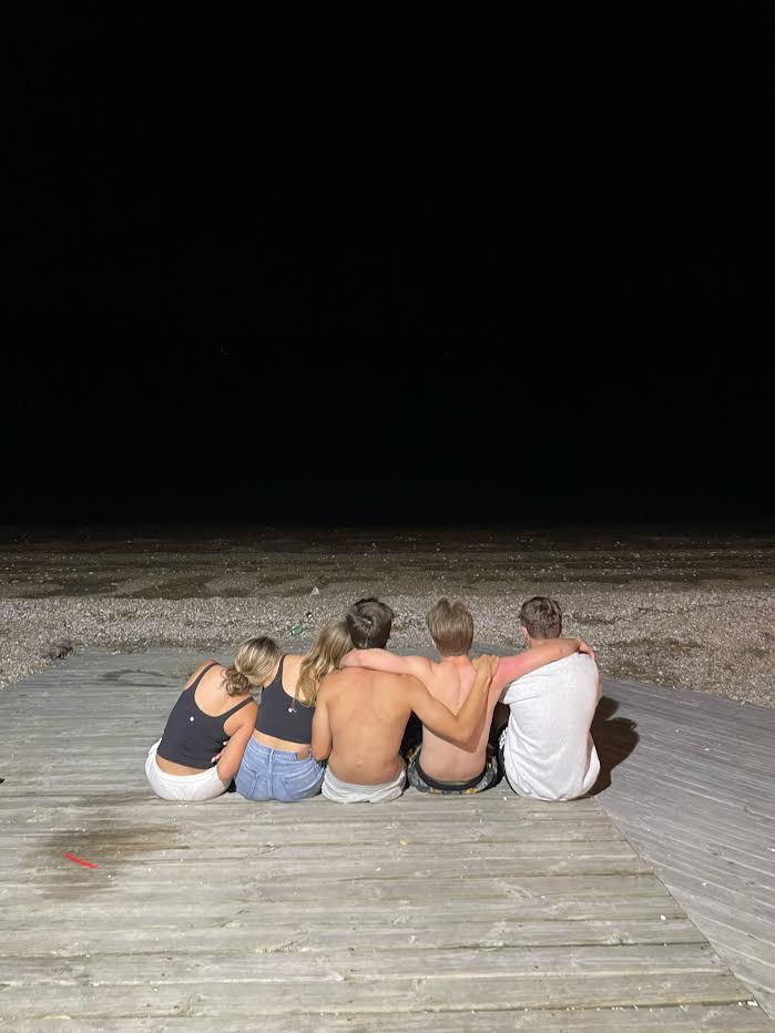 This is a photo of my friends at a beach with the darkness 