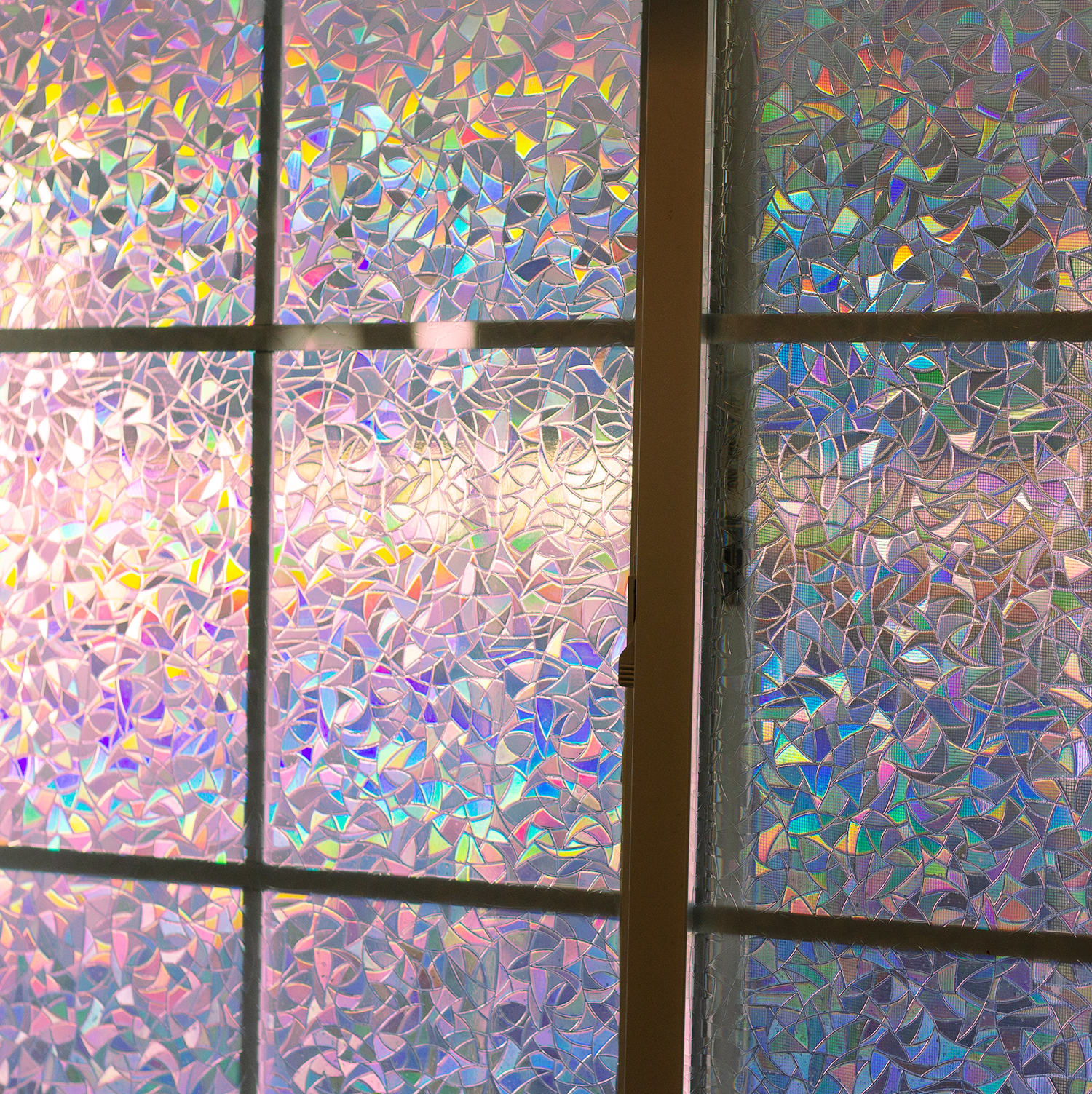 Light coming through a artificial-stained-glass window in rainbow pastel colors