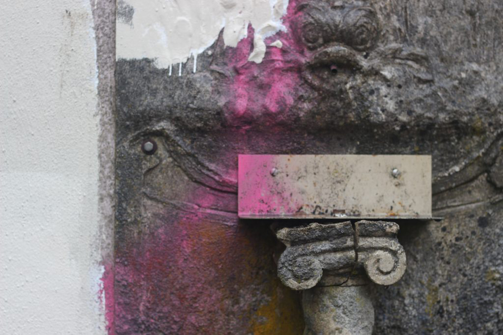 an old wall with spray paint