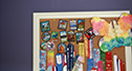 This board from Mandy's room shows her swimming and soccer achievements as well as wildlife badges.