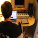 Scott Delamare producing music at his at home studio.