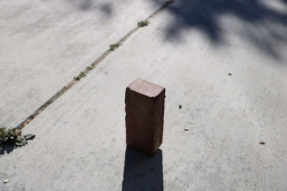 A photo of a brick in the sun.