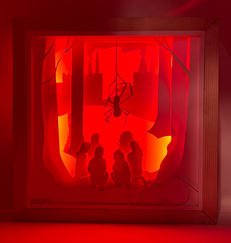 Light box with people and spiders in forest