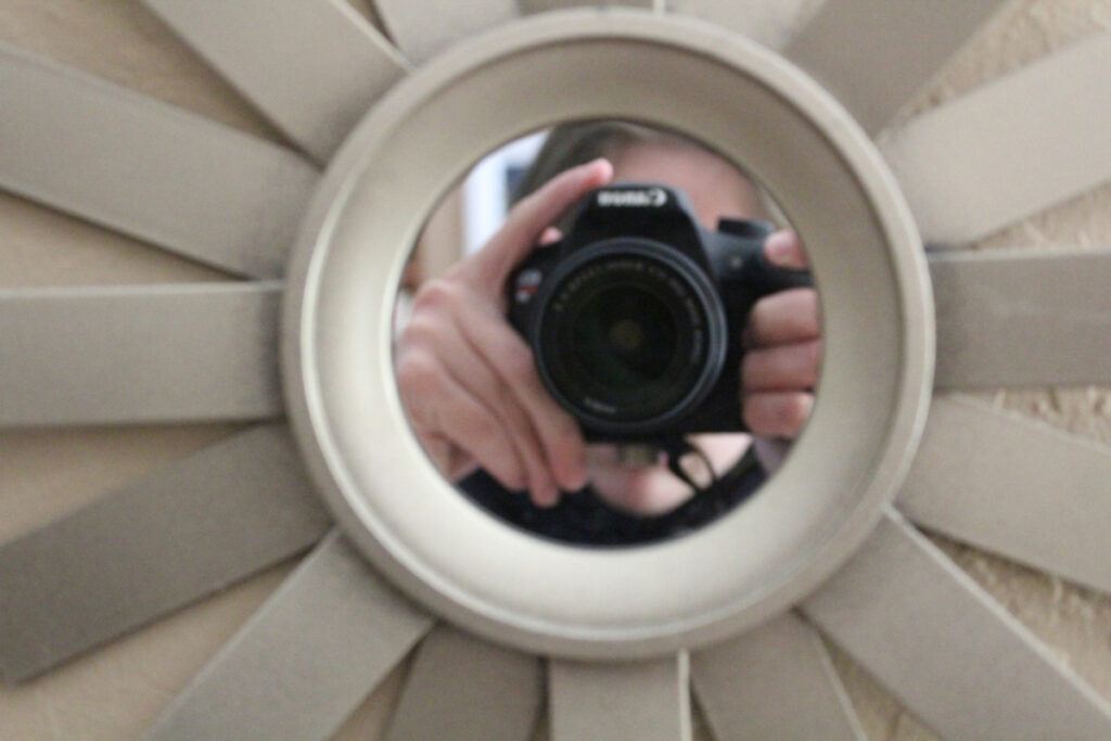 camera in reflection of circular mirror
