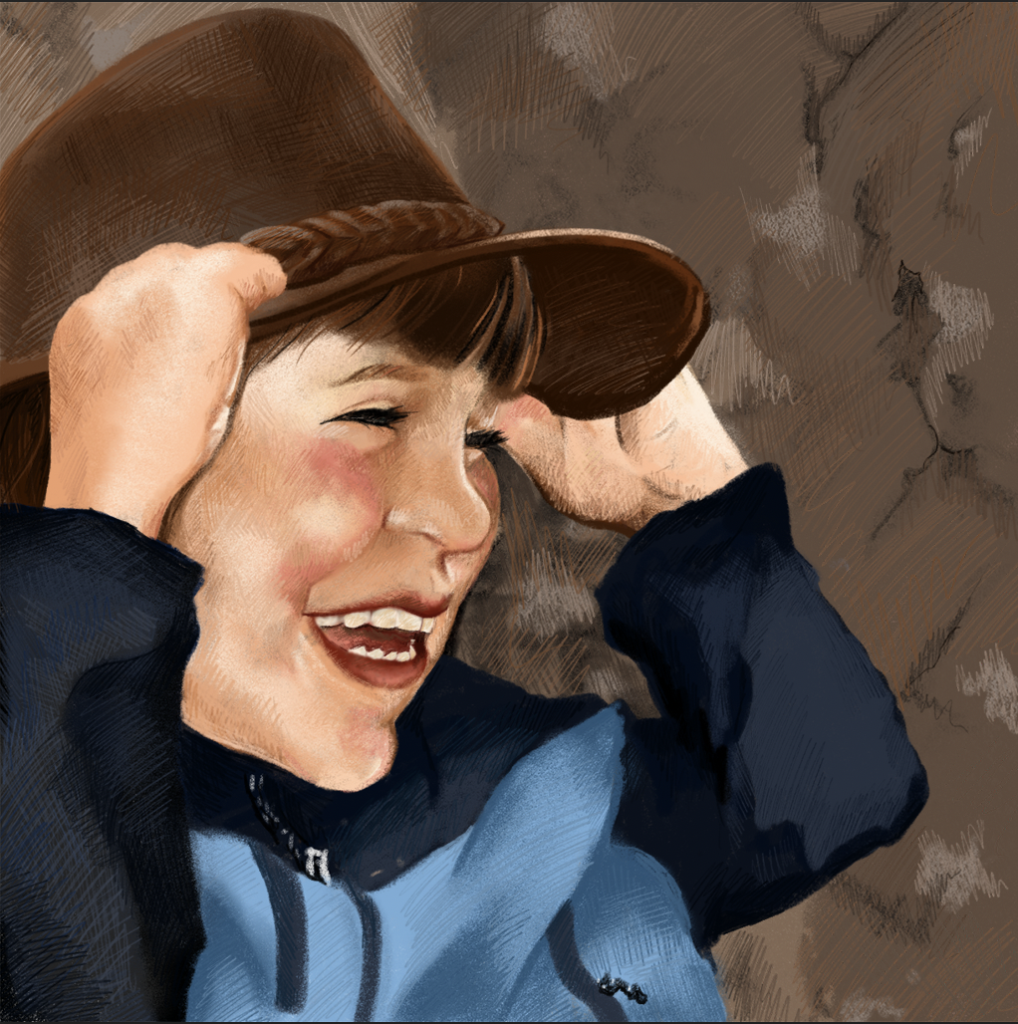 kid holding hat