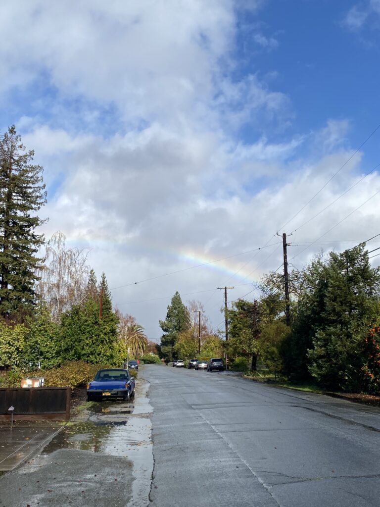 Rainbow over residential street
