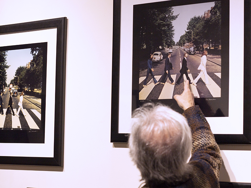 Theron Kabrich pointing out the difference between takes of the Abbey Road album cover